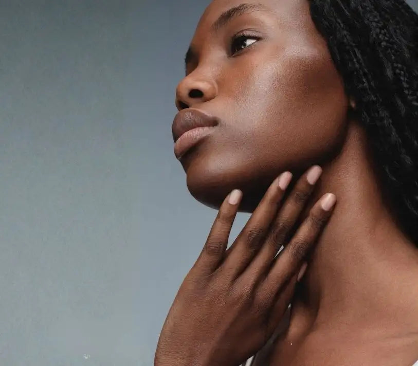Woman with dry dehydrated skin touching her jawline