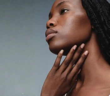 Woman with dry dehydrated skin touching her jawline